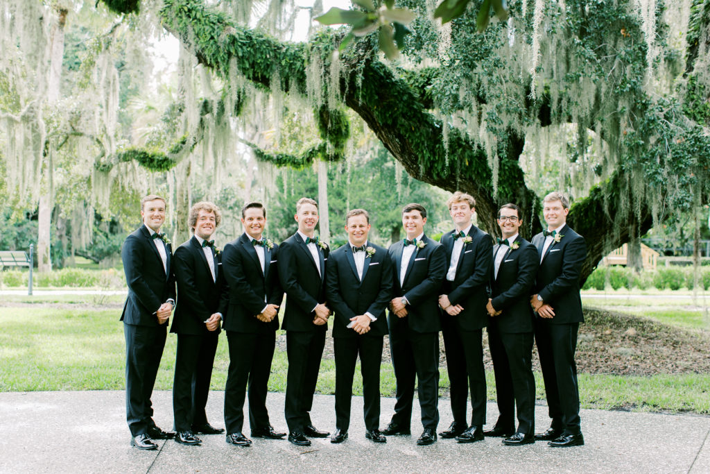 The Groom and Groomsmen under the cypress trees at Crane Cottage